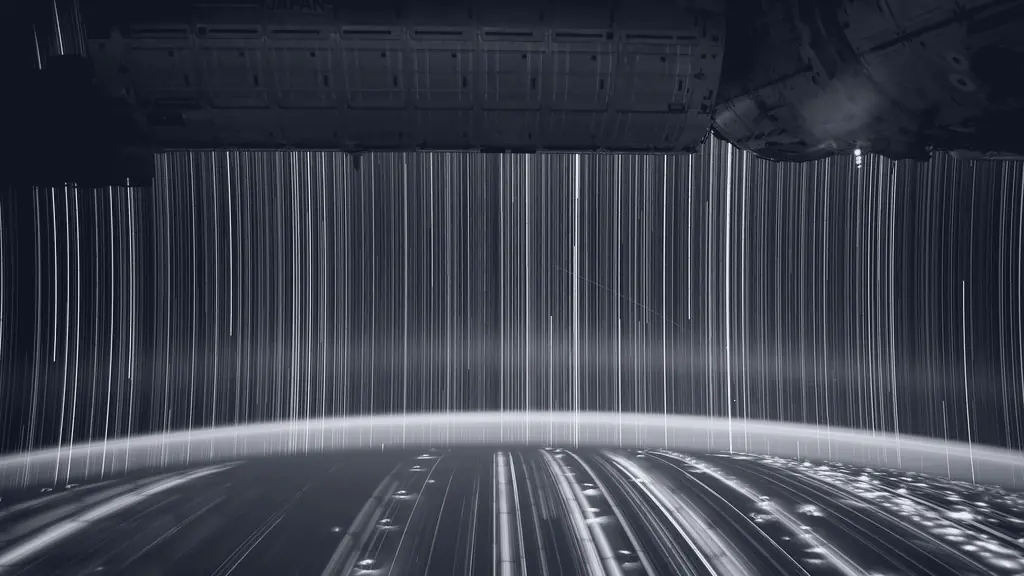 Light trails under a bridge at night